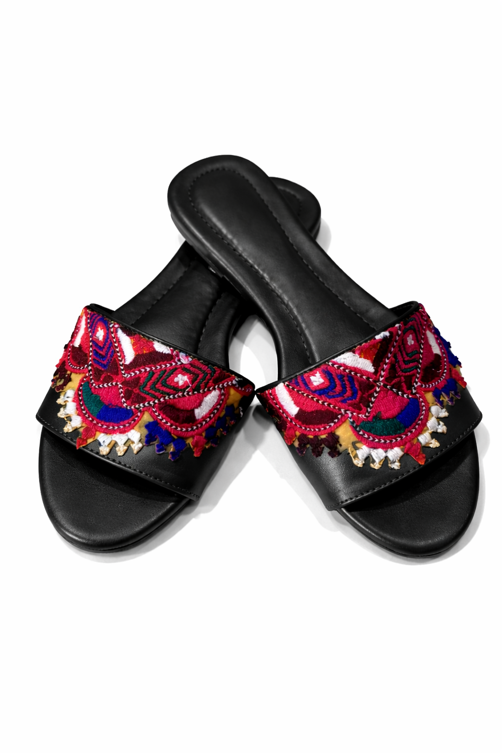 Black slides with colorful floral patterns on a white background