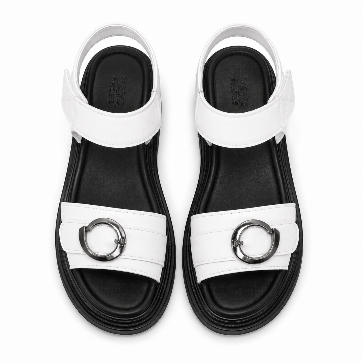 Orbit White platform sandals from ROAMÉ by VAYA featuring premium white synthetic leather straps, silver buckle details, a black cushioned footbed, and a lightweight PU platform sole for everyday comfort.